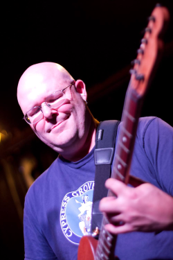 Photo: Sean Ennis on guitar. Photo Credit: Terrence McNally